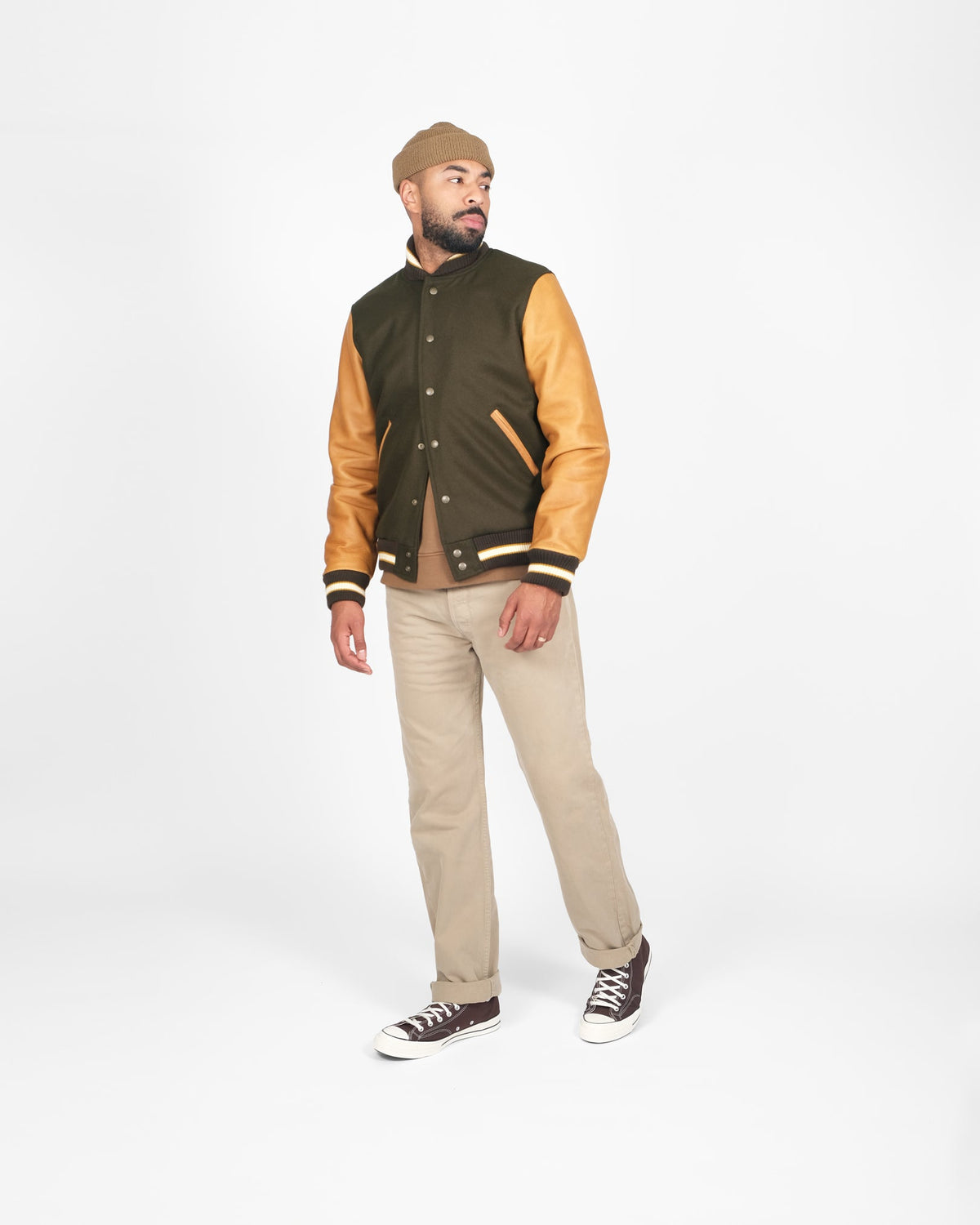 mdel posing wearing varsity jacket