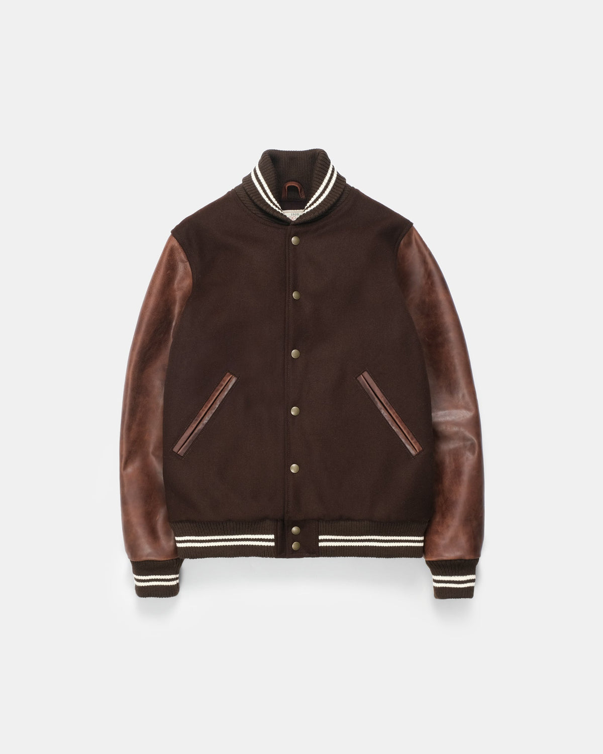 Brown leather jacket with white trim on a light gray background