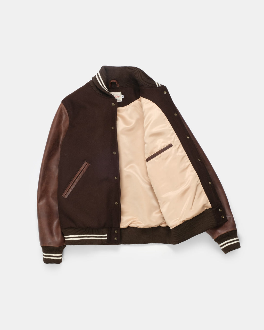 Brown and beige varsity jacket on a white background