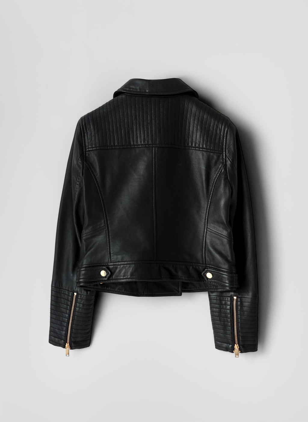 Black leather jacket on a light gray background