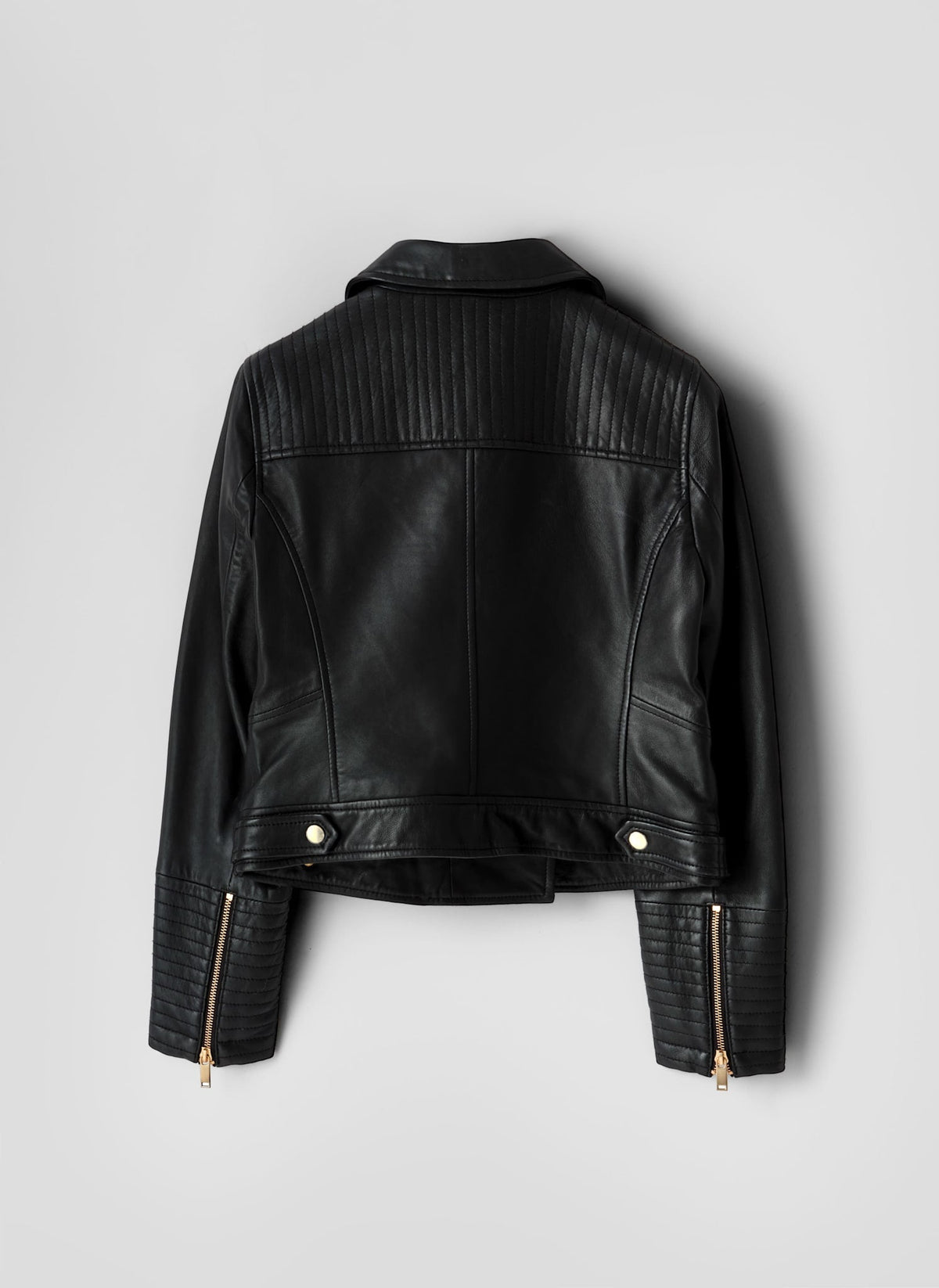 Black leather jacket on a light gray background