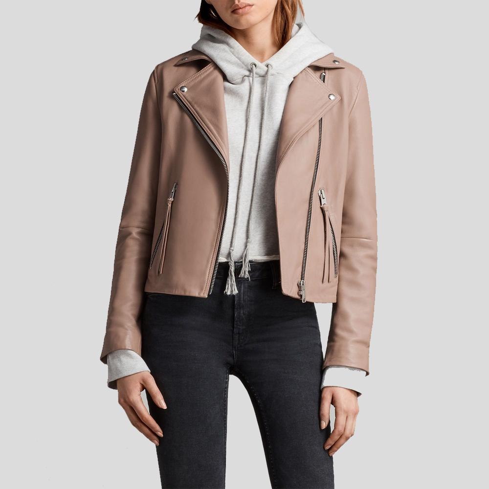 Person wearing a beige leather jacket over a white hoodie on a light gray background